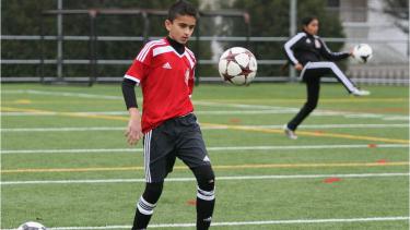 Soccer player practising