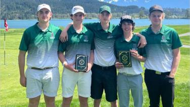 Five male golfers pose with two plaque trophies for wining tournament