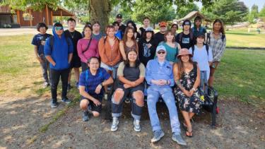 Indigenous Summer School Program 2023 Group of Indigenous students sitting with Elder