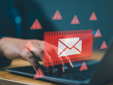 Alert Email inbox and spam virus with warning caution.
