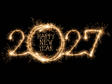 Sparkler lights forming “2027 Happy New Year” against a dark background.