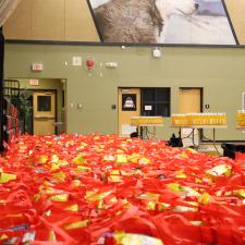 Over 200 food hampers sitting on the gym floor