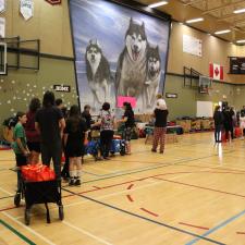 Families lined up in the gym to pick up their school supplies